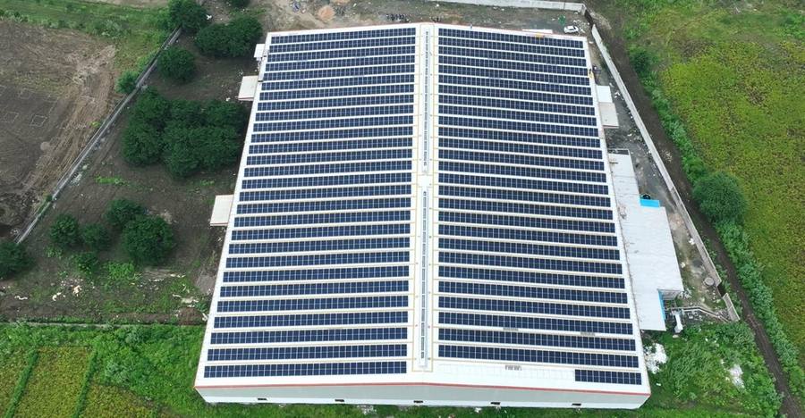 Completed rooftop solar installation, drone view